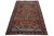 This vintage hand-knotted wool rug features a rust field with multicolor accents throughout the design. This rug measures...