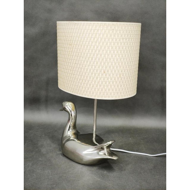 A delightful italian table lamp dating from the 1970s, combining playful sculptural design with refined mid-century modern...
