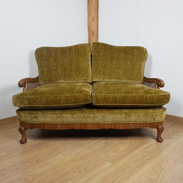 An early 20th century bergére lounge sofa. Solid and burr walnut throughout with original bergère cane work in very good...