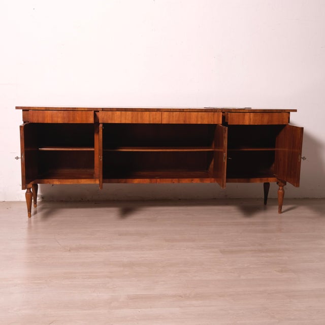 Original sideboard, Italian design and production from the 1950s. It features four drawers and three large, convenient...