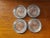 This is a Set of 4 Glass Drink Coasters with Silverplated Trim. Each measures 3/4" high and 3 3/4“ in diameter. The pieces...
