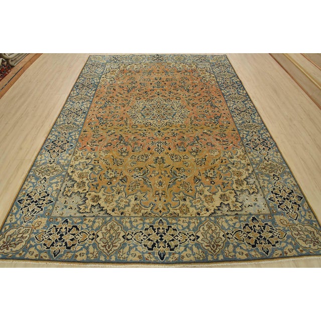 An authentic vintage traditional Najafabad rug hand-knotted with fine wool and natural dyes. This oriental rug features a...
