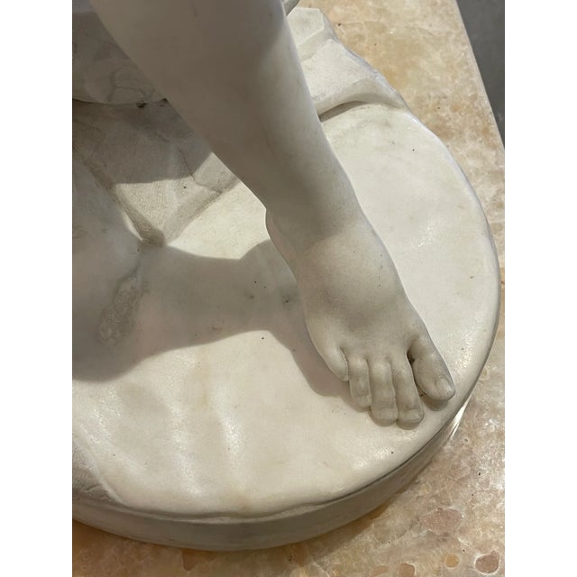 This exquisite sculpture is a testament to the enduring beauty of the human form. Crafted from pristine Carrara marble,...