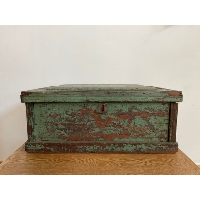 Perfectly imperfect...bringing authentic charm of this antique rustic wooden chest, featuring a deeply layered, heavily...