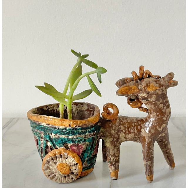 Mid-century pottery art donkey and cart figurine. Very likely made in Italy but the piece is unmarked. This colorful piece...
