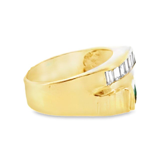 Vintage 14K yellow gold off-set double row emerald and diamond band ring. Emeralds: 0.60 ctw. Diamonds: 0.70 ctw. Color:...
