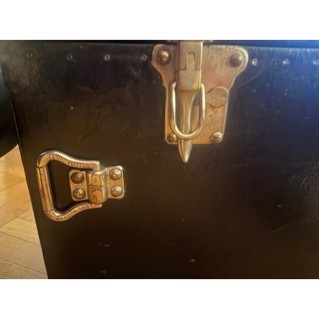 Black vintage Louis Vuitton trunk. Has general wear and tear that only adds to the beauty of the piece