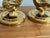 Late 20th century brass dolphin candlestick holder pair, attributed to Brighton, in a neoclassical mythology design....