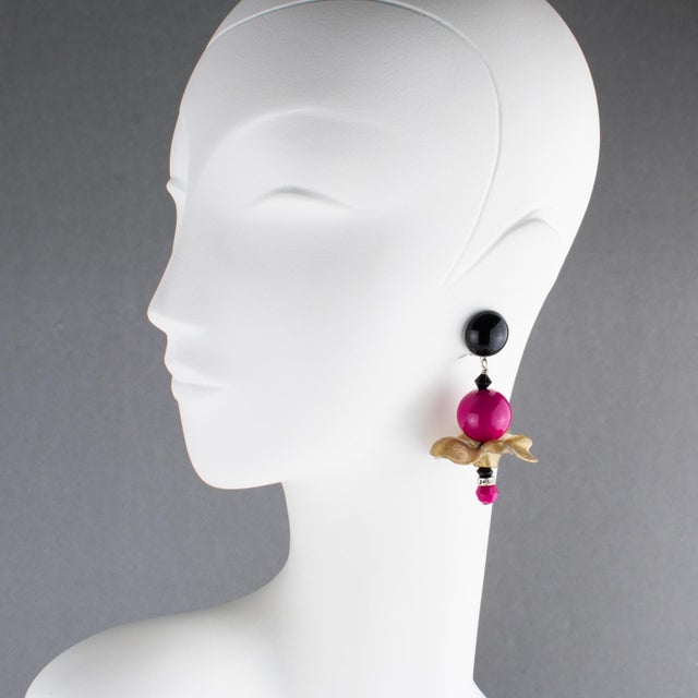 These stunning Angela Caputi, made-in-Italy, resin clip-on earrings feature an important dangling design with wavy-shaped...