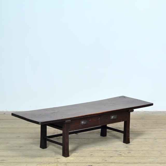 This authentic low Japanese table exudes simplicity, craftsmanship, and timeless elegance. Crafted from solid wood with a...