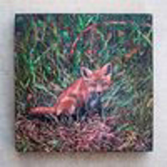 This oil on wood panel depicts a young fox nestled among lush grasses, its striking orange fur contrasting beautifully...
