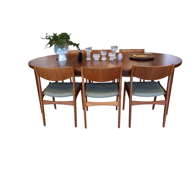 Elegant Danish vintage chairs in teak, designed by Henning Kjærnulf for Sorø Stolefabrik in Denmark. The model is a fine...