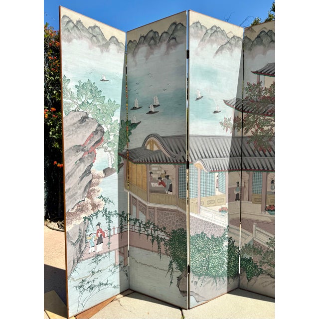 This exceptional mid-20th-century Chinese six-panel folding screen is a striking, hand-painted work of art on solid wood...