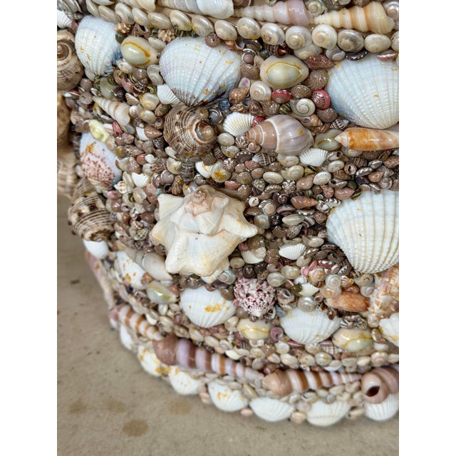 A wonderfully unique vintage resin planter completely covered by hand in an incredible assortment of natural seashells....