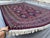 This bold Ersari rug features a striking grid of large octagonal gul medallions in deep navy, each densely patterned with...