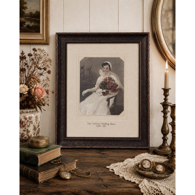 A beautifully preserved early 20th-century hand-colored bridal portrait presented in its original carved wood frame and...