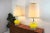 Take a look at this beautiful pair of lamps, the bodies are yellow glass and the base and necks are chrome. They are...
