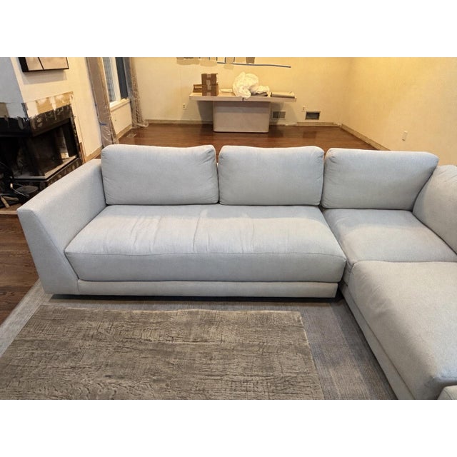 Custom Room & Board Clemens sectional with matching ottoman, purchased in October 2024 and in excellent condition....