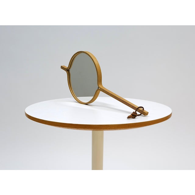 This rare handheld mirror, designed by Jørgen Gammelgaard, exemplifies the refined simplicity and expert craftsmanship of...
