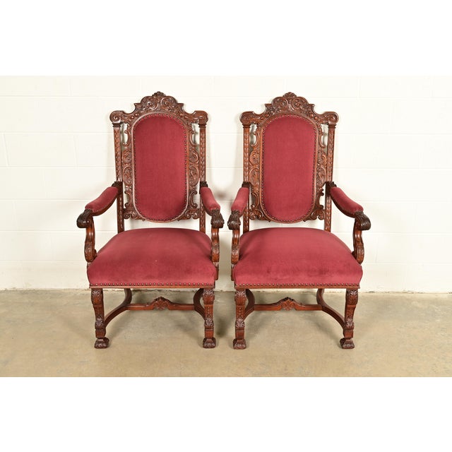 An exceptional pair of antique Victorian or Renaissance Revival armchairs or dining captain chairs In the manner of R.J....