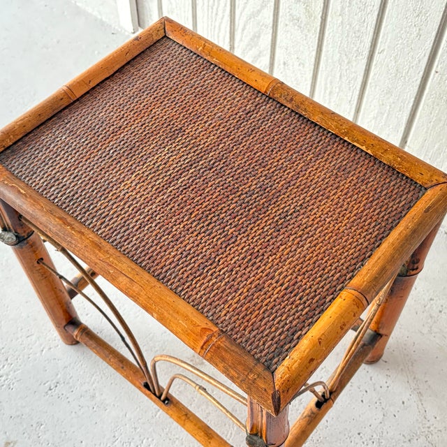 A vintage, mid-century chinoiserie side table, handmade with bamboo wood and woven bamboo surface.
