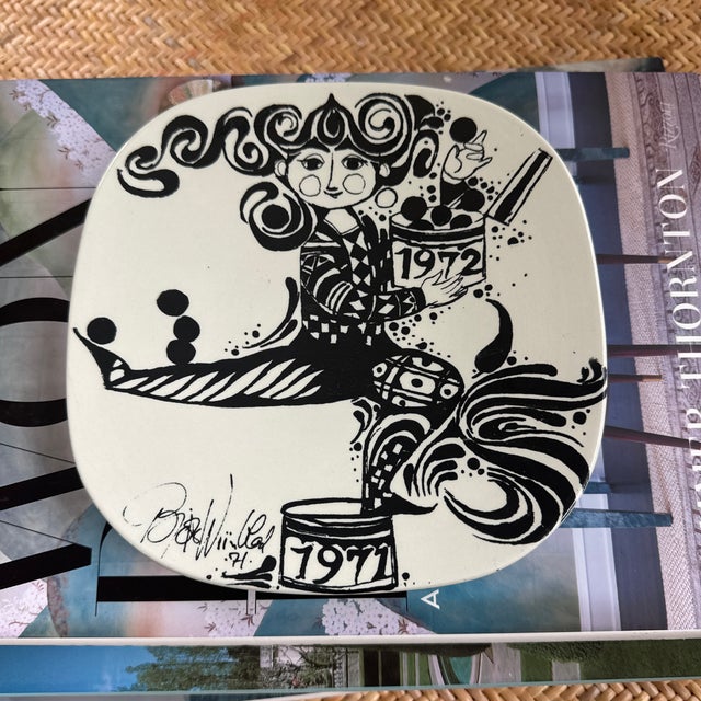 Highly collectible commemorative plate by Danish designer Bjorn Wiinblad, known for his cheerful and whimsical designs....