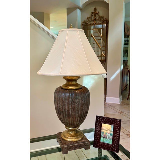 Beautiful pair of urn-style table lamps from Ambiance, originally purchased from an exclusive Charlotte designer. Rich...