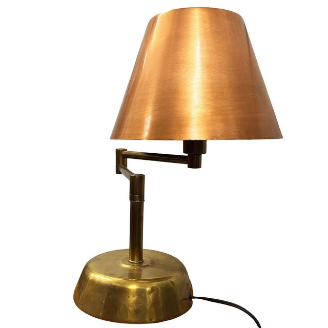 Art Deco Copper & Brass Machine Age Swing-arm Reading Table Lamp Sleek and sculptural, this Mid-Century Modern table lamp...