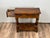 This handsome vintage oak accessory table by Yorkshire House showcases the charm of English craftsmanship and rustic...