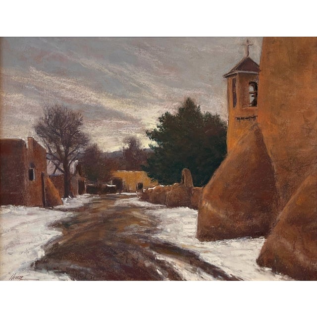 Quiet Winter Walk by Lorenzo Chavez | Pastel depicting a snow-covered village road with buildings. For Sale