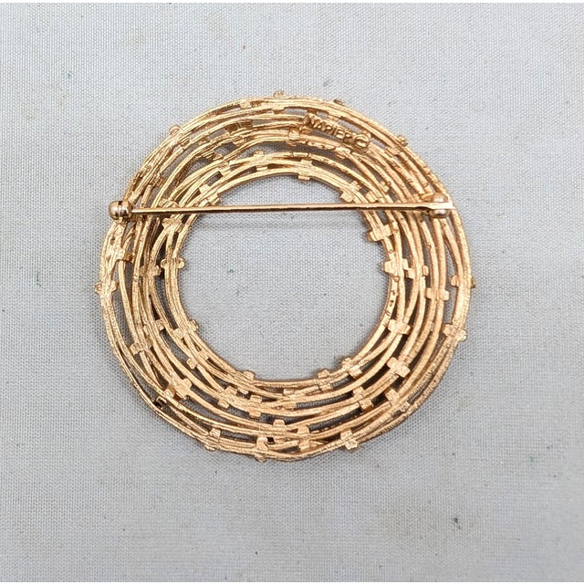 1970s Modernist matte goldtone textured wired circle or wreath with shiny "woven" or gathered sections brooch with...