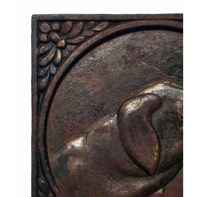 Vintage square cast iron relief plaque with residual brass featuring the side-profile head of a hunting or hound-type dog...