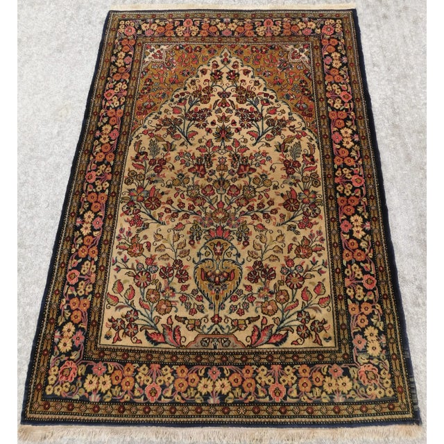 Central ascending vase on a luscious ivory background filled with flowers. Floral decorated blue border.