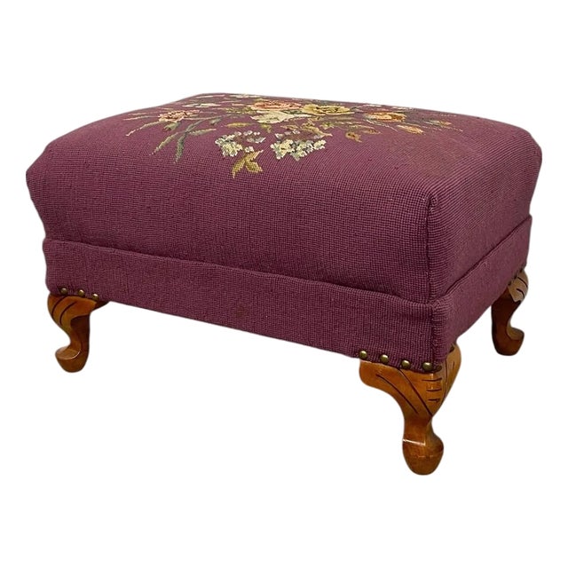 Vintage Upholstered Footstool Ottoman With Floral Needlepoint and Carved Wood Legs For Sale