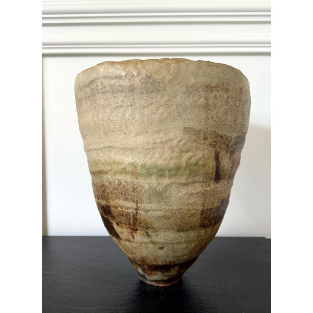A large conical form vase by British ceramicist Ewen Henderson (1934-2000) circa 1970s. The stoneware vessel was hand...