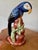 Vintage Italian majolica ceramic parrot, beautifully hand-painted and glazed in brilliant shades of blue and black....