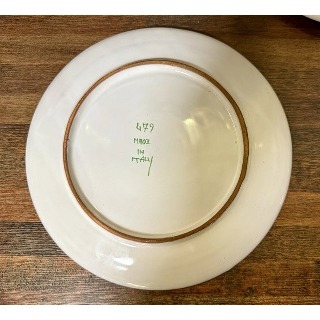 Beautiful vintage Italian majolica vegetable salad plates featuring vibrant hand-painted designs and rich ceramic...