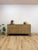This vintage mid-century modern dresser showcases a striking gray washed, blonde wood finish that offers a lighter, more...