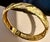 This 24 karat yellow gold Bangle bracelet is a stunning piece of jewelry crafted from authentic solid gold. The Bangle...