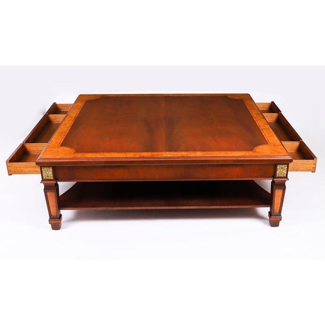 This is a superb inlaid walnut coffee table by the high-quality cabinet maker and retailer Charles Barr, dating from the...