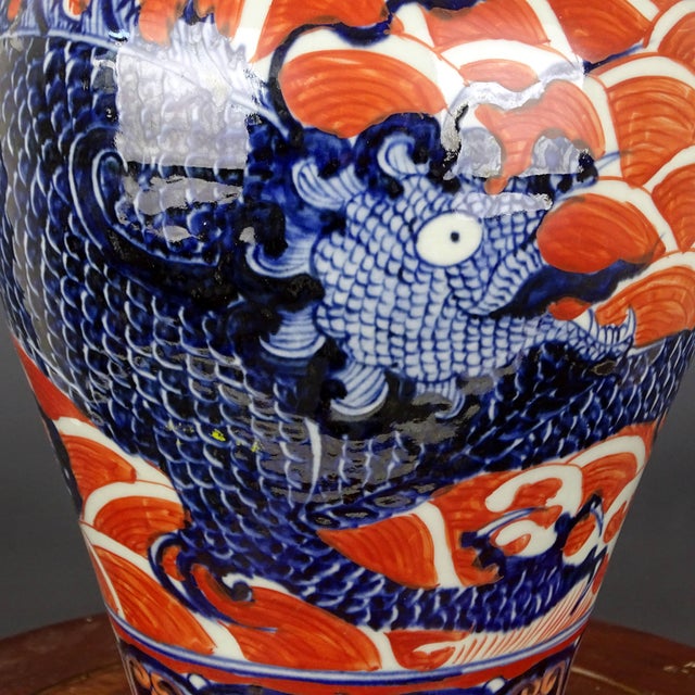 W-21cm,H-39.8cm This Xuande marked red glaze blue and white porcelain vase features a painted dragon pattern, showcasing...