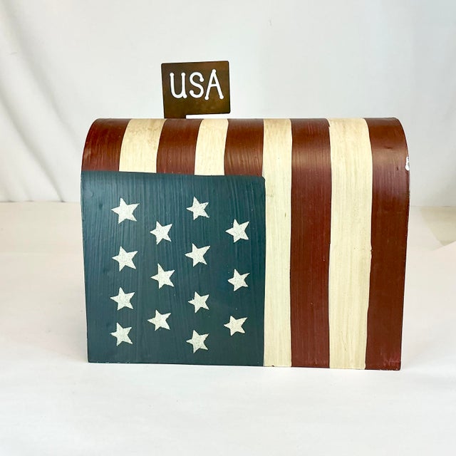This is a delightful red-white-blue Flag motif mail box. It’s a whimsical decorative Holiday Accent piece intended to be...