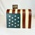 This is a delightful red-white-blue Flag motif mail box. It’s a whimsical decorative Holiday Accent piece intended to be...