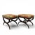 A pair of custom curule benches or ottomans upholstered in a striking fabric. Designed by Scott Arthur Yerkley, they are...