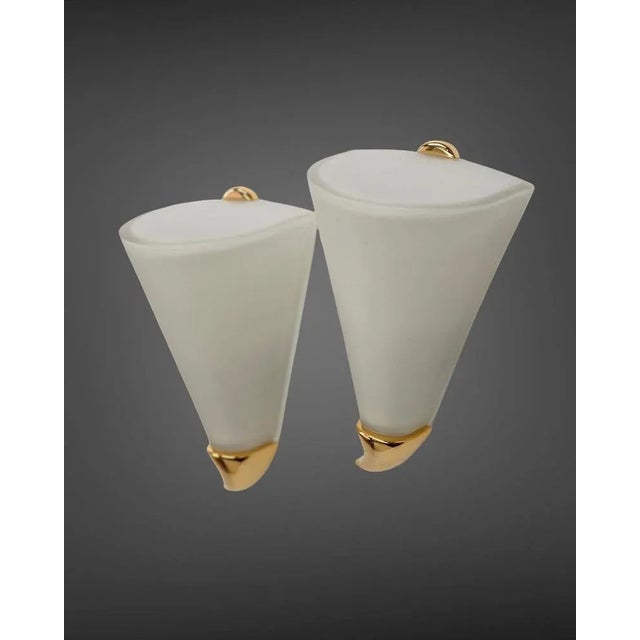 - Pair of sconces from the Belgian company Deknudt - Well suited for the bathrooms - Made of opaline glass and brass -...