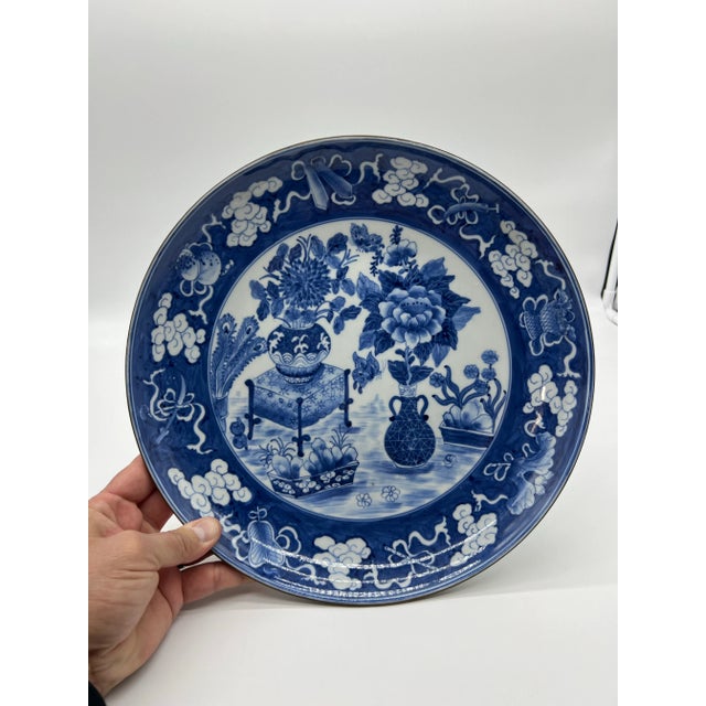 A Vintage Chinese Porcelain Blue Decorated Charger With a Brass Rim, Circa 1930's Chinese porcelain, circa 1930-1950. Blue...