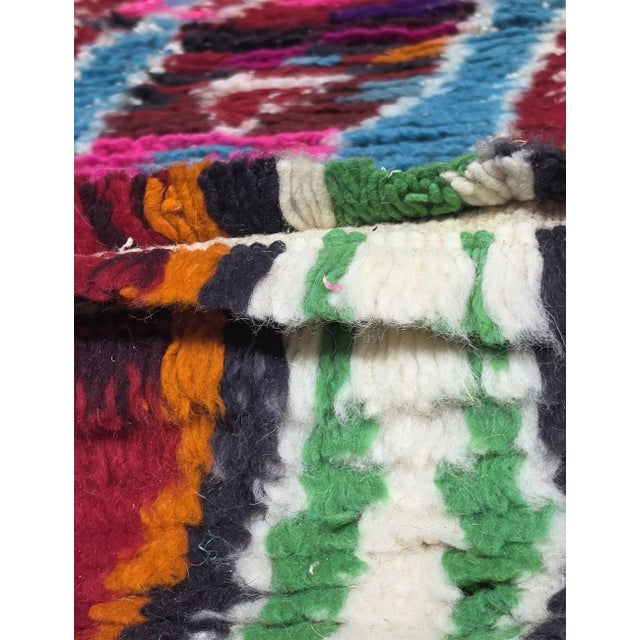 Modern Boujad Rug | Handwoven Wool Rug in Maroon, Blue & Pink with Layered Diamond Motifs This intensely layered modern...