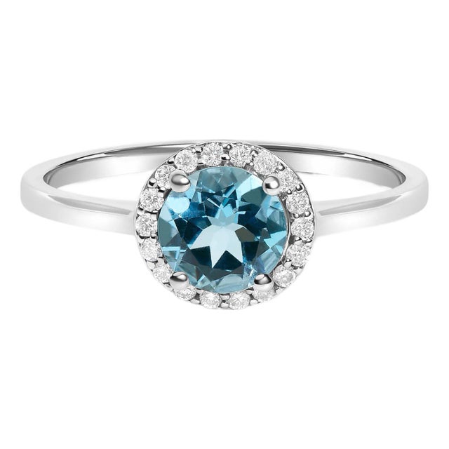 10K White Gold Blue Topaz and 1/10 Cttw Diamond Halo Ring For Sale