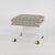 Post-Modern lucite ottoman or vanity seat with waterfall sides, a lower shelf, and gold-tone casters for versatility. Made...