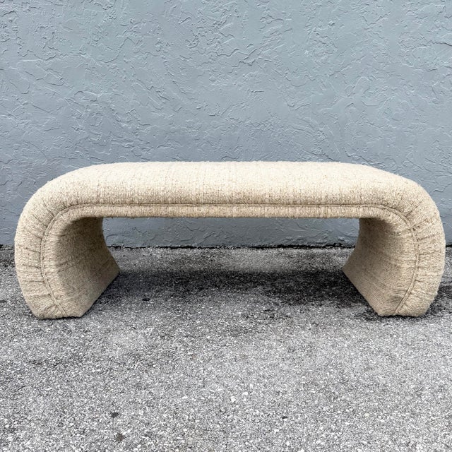 This postmodern waterfall bench makes a sculptural statement with its bold, flowing silhouette. Fully upholstered in nubby...